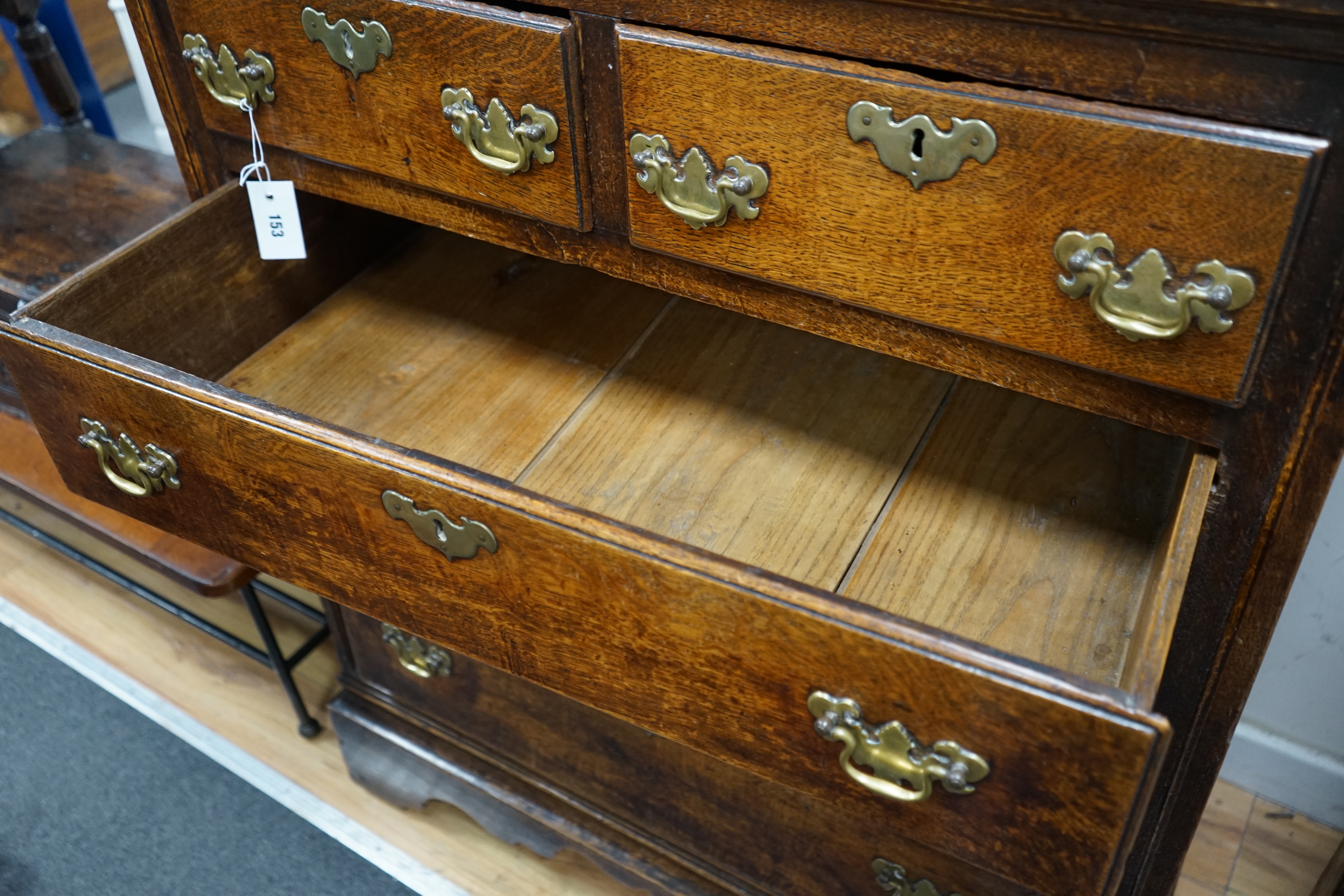 Am 18th century oak chest of two short and three long drawers fitted with brass handles, width 94cm depth 51cm height 114cm